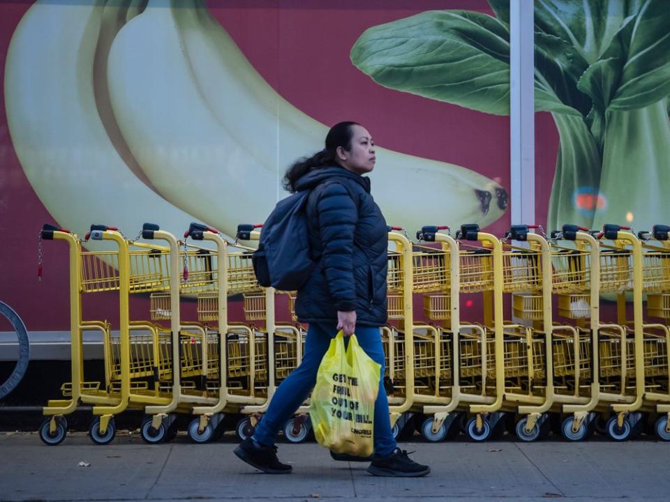  A pedestrian walks past a No Frills grocery store in Toronto.