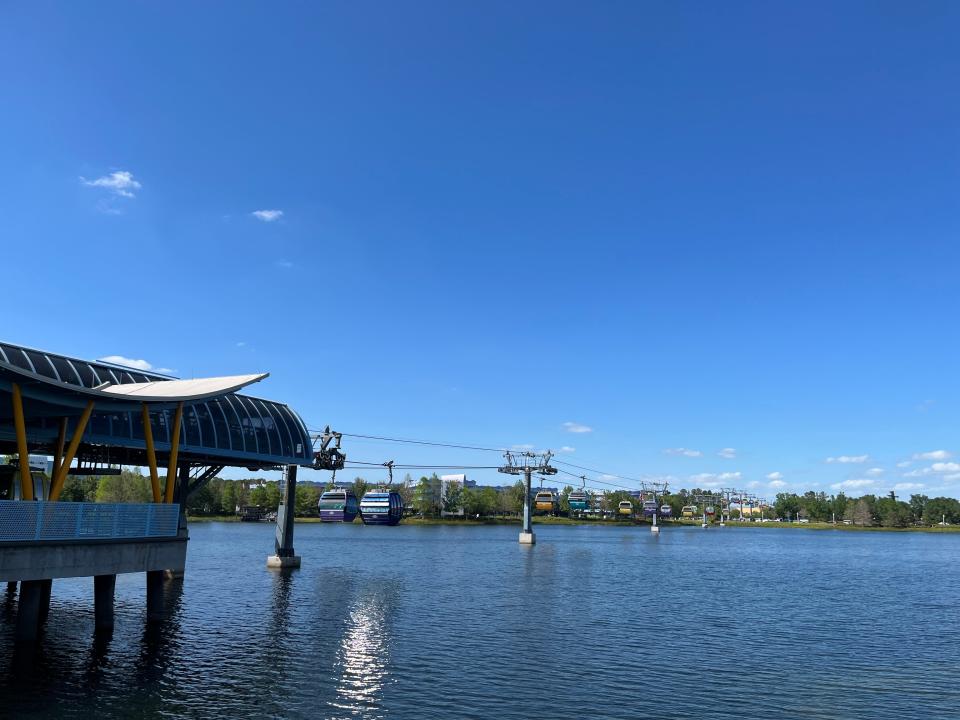 view of the skyliner over body of water from pop century resort at disney world