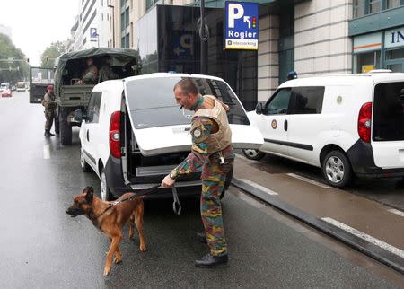 A K9 unit arrives outside the City2 shopping complex which was evacuated following a bomb scare in Brussels, Belgium, June 21, 2016. REUTERS/Francois Lenoir