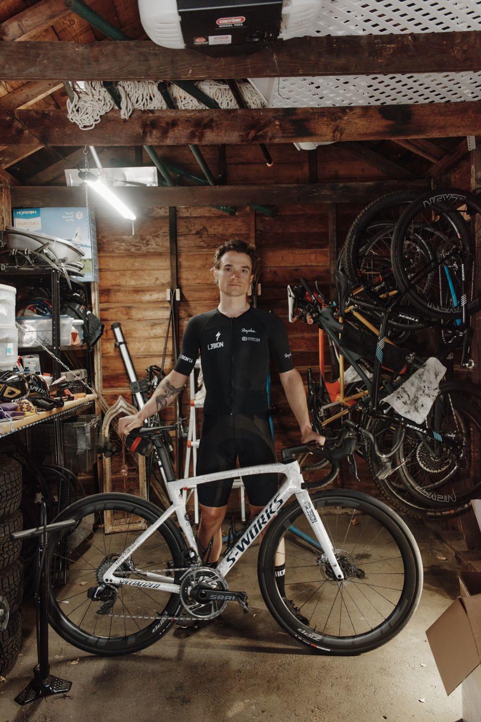 robin carpenter standing behind his s works bike in garage