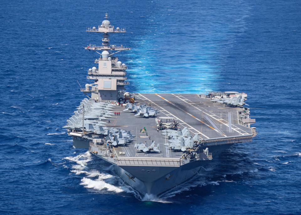 Aircraft attached to Carrier Air Wing (CVW) 8 sit on USS Gerald R. Ford's (CVN 78) flight deck as the ship steams through the Atlantic Ocean, April 13, 2022