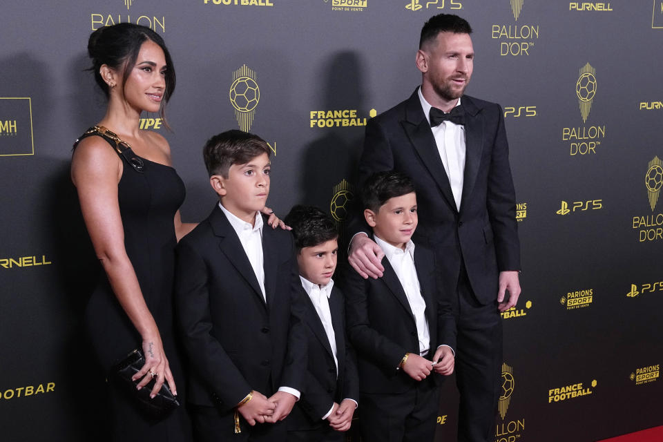 Inter Miami's Lionel Messi, right, with Antonela Roccuzzo, left, and their children pose for a picture prior the 67th Ballon d'Or (Golden Ball) award ceremony at Theatre du Chatelet in Paris, France, Monday, Oct. 30, 2023. (AP Photo/Michel Euler)