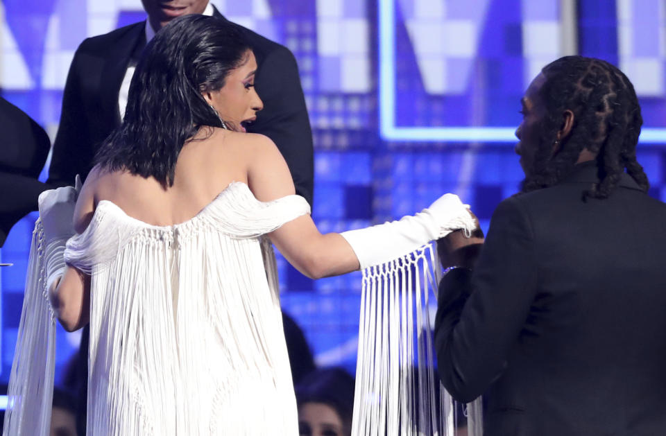 Cardi B, left, and Offset appear on stage to accept the award for best rap album for "Invasion of Privacy" at the 61st annual Grammy Awards on Sunday, Feb. 10, 2019, in Los Angeles. (Photo by Matt Sayles/Invision/AP)