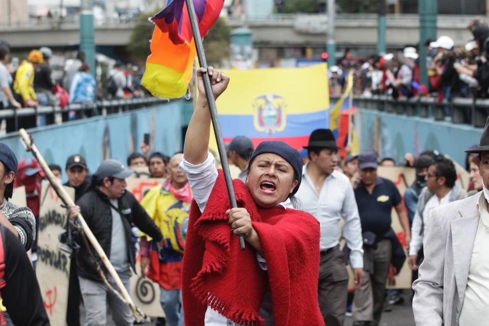Indigenous anti-government demonstrators chant slogans against President Lenin Moreno and his economic policies during a nationwide strike, in Quito, Ecuador, Wednesday, Oct. 9, 2019. Ecuador's military has warned people who plan to participate in a national strike over fuel price hikes to avoid acts of violence. The military says it will enforce the law during the planned strike Wednesday, following days of unrest that led President Lenín Moreno to move government operations from Quito to the port of Guayaquil. (AP Photo/Carlos Noriega )