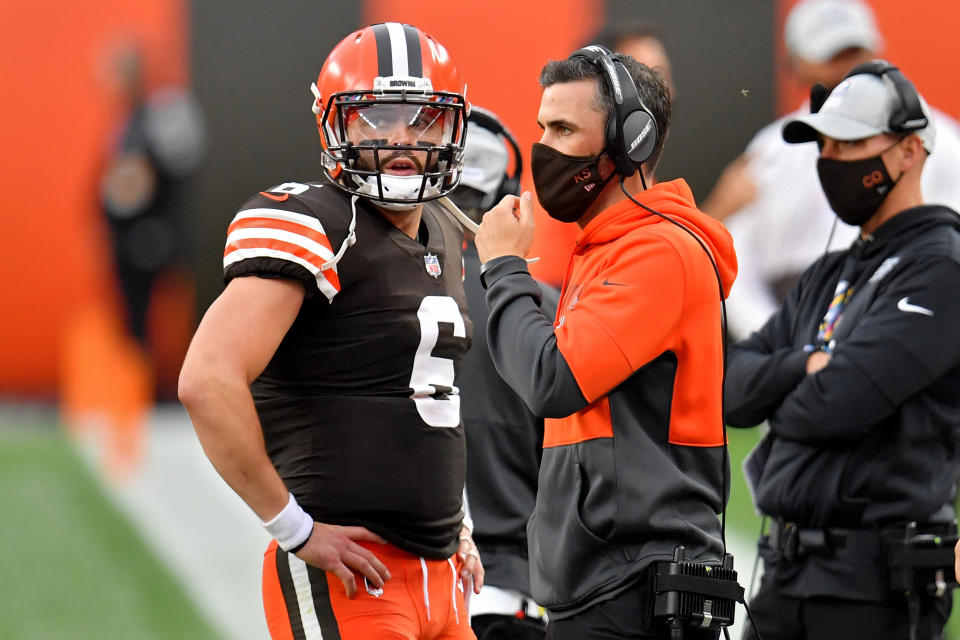 Cleveland Browns QB Baker Mayfield meets with head coach Kevin Stefanski in a 2020 game against the Indianapolis Colts. (Jason Miller/Getty Images)