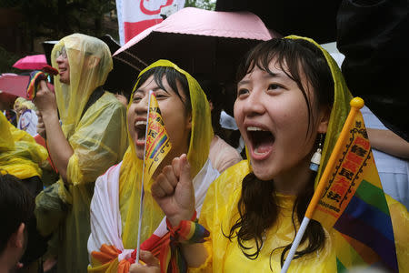 Same-sex marriage supporters shout during a parliament vote on three draft bills of a same-sex marriage law, outside the Legislative Yuan in Taipei, Taiwan May 17, 2019. REUTERS/Tyrone Siu