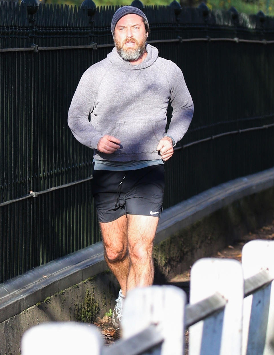 <p>Jude Law works up a sweat while out for a jog near his home in North London on Sunday. </p>