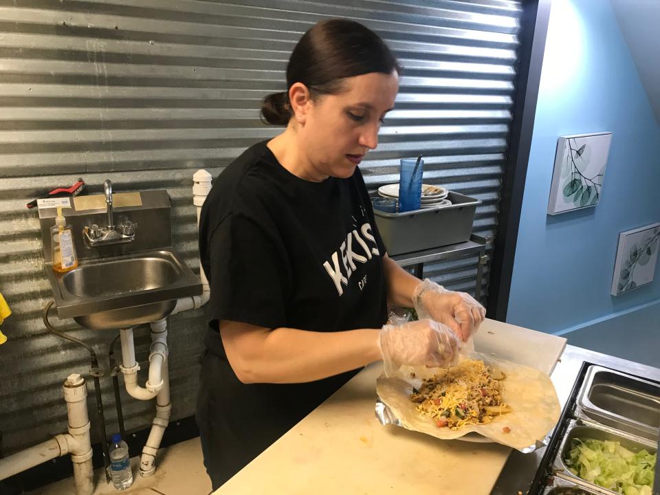 Dora Ortiz, owner of Kekis Cafe in Fremont, makes a breakfast burrito with chorizo at the restaurant's 601 W. State St. location. Kekis opened June 7 and is open seven days a week from 7 a.m. to 2 p.m.