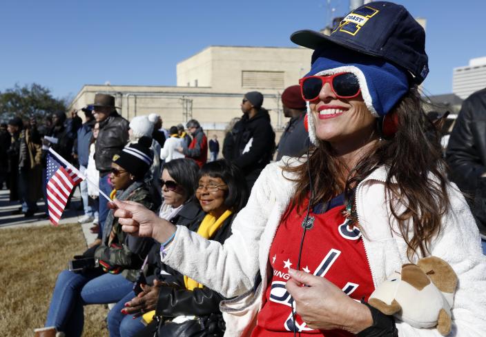 <p>Michael Avandale, of Los Angeles, waves an American flag as she and others enjoy the state’s bicentennial celebration and the grand opening ceremony for the two museums, the Museum of Mississippi History and the Mississippi Civil Rights Museum, Saturday, Dec. 9, 2017, in Jackson, Miss. (Photo: Rogelio V. Solis/AP) </p>