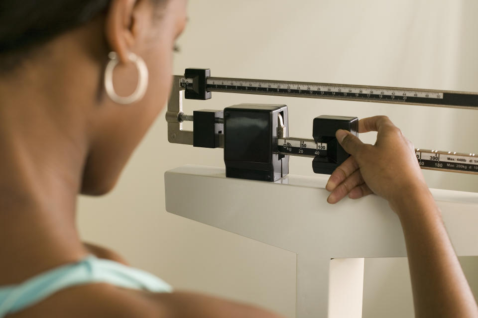 woman weighing herself