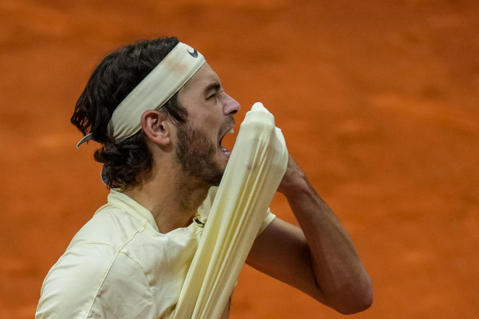 Taylor Fritz, of the United States, reacts during his match against Zhang Zhizhen of China at the Madrid Open tennis tournament in Madrid, Spain, Tuesday, May 2, 2023. (AP Photo/Manu Fernandez)