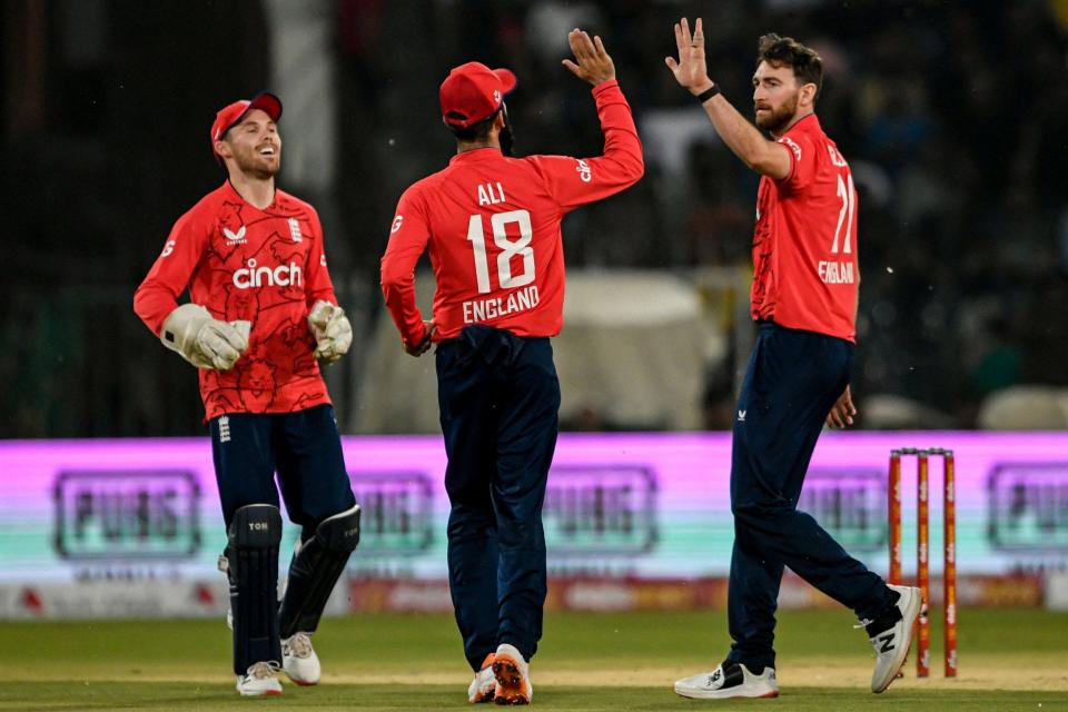 England's Richard Gleeson (R) celebrates with teammate Moeen Ali - AAMIR QURESHI/AFP via Getty Images