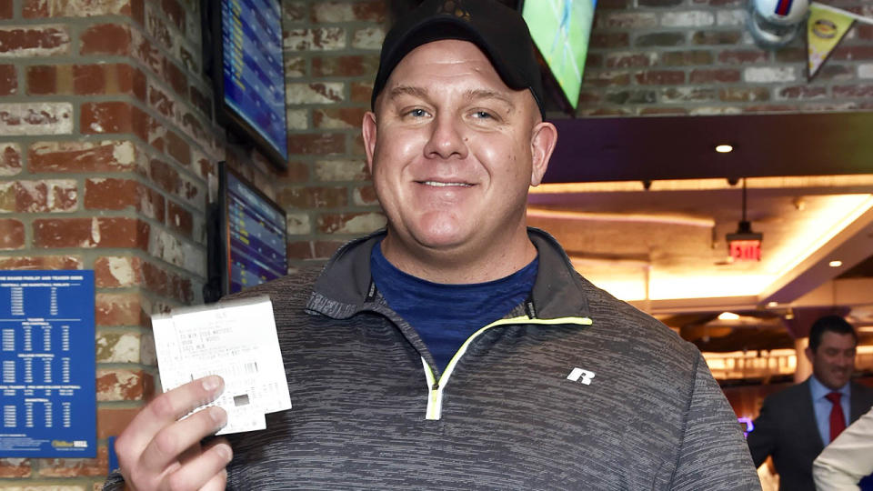 James Adducci stands with his winning tickets. (Photo by David Becker/Getty Images for William Hill US)