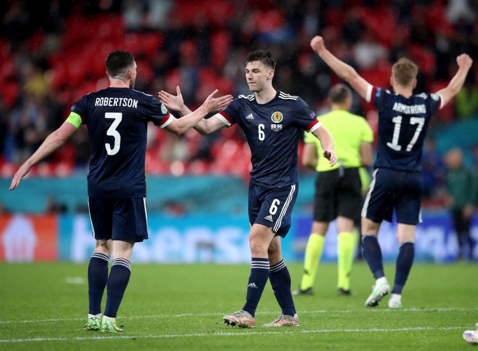 Andrew Robertson and Kieran Tierney react after the match (PA)