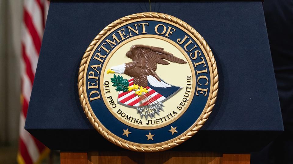 Podium with DOJ logo