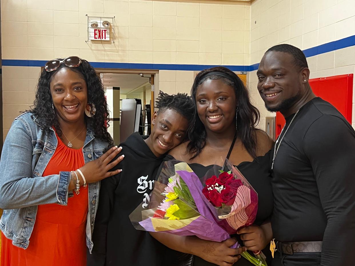 Joseph Roberts, right, with his wife Bree, left, and two kids.