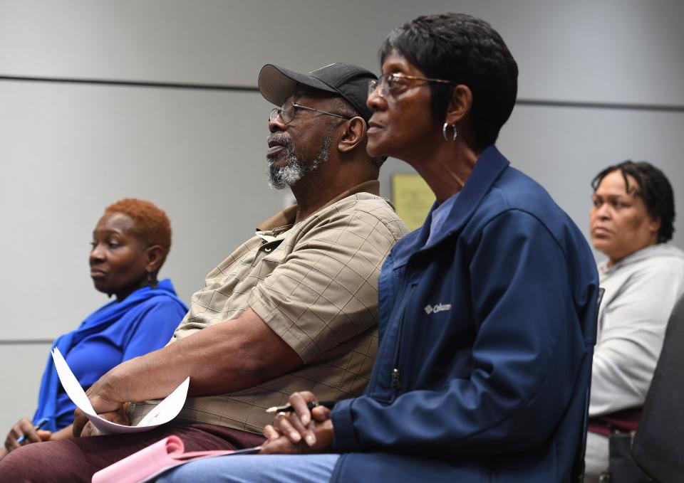 Librarian Ashley Bright  talks about African-American genealogy at Greenville's Berea (Sarah Dobey Jones) Branch library on Feb. 8, 2023. Edward Watkins, center, and his sister Brenda W. Brock, to his right, came to get tips on how to trance their family's history. 