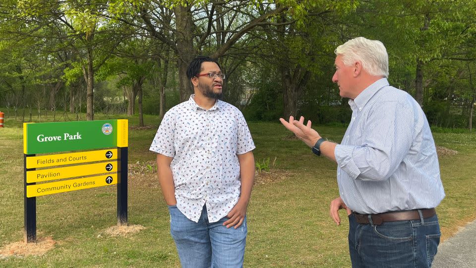 Carey Fulks and John King walk through Grove Park on the outskirts of Atlanta. - CNN