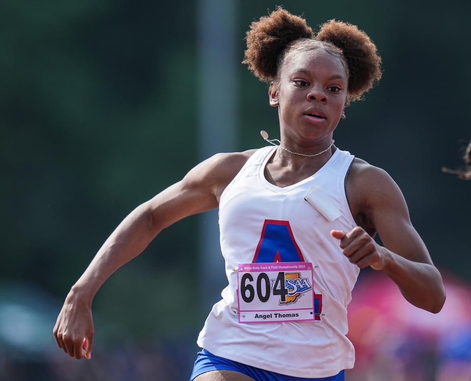 South Bend Adams Angel Thomas crosses the finish line to win the 100 meter dash Saturday, June 3, 2023, during the IHSAA girls track and field state finals at Robert C. Haugh Track and Field Complex at Indiana University in Bloomington. 