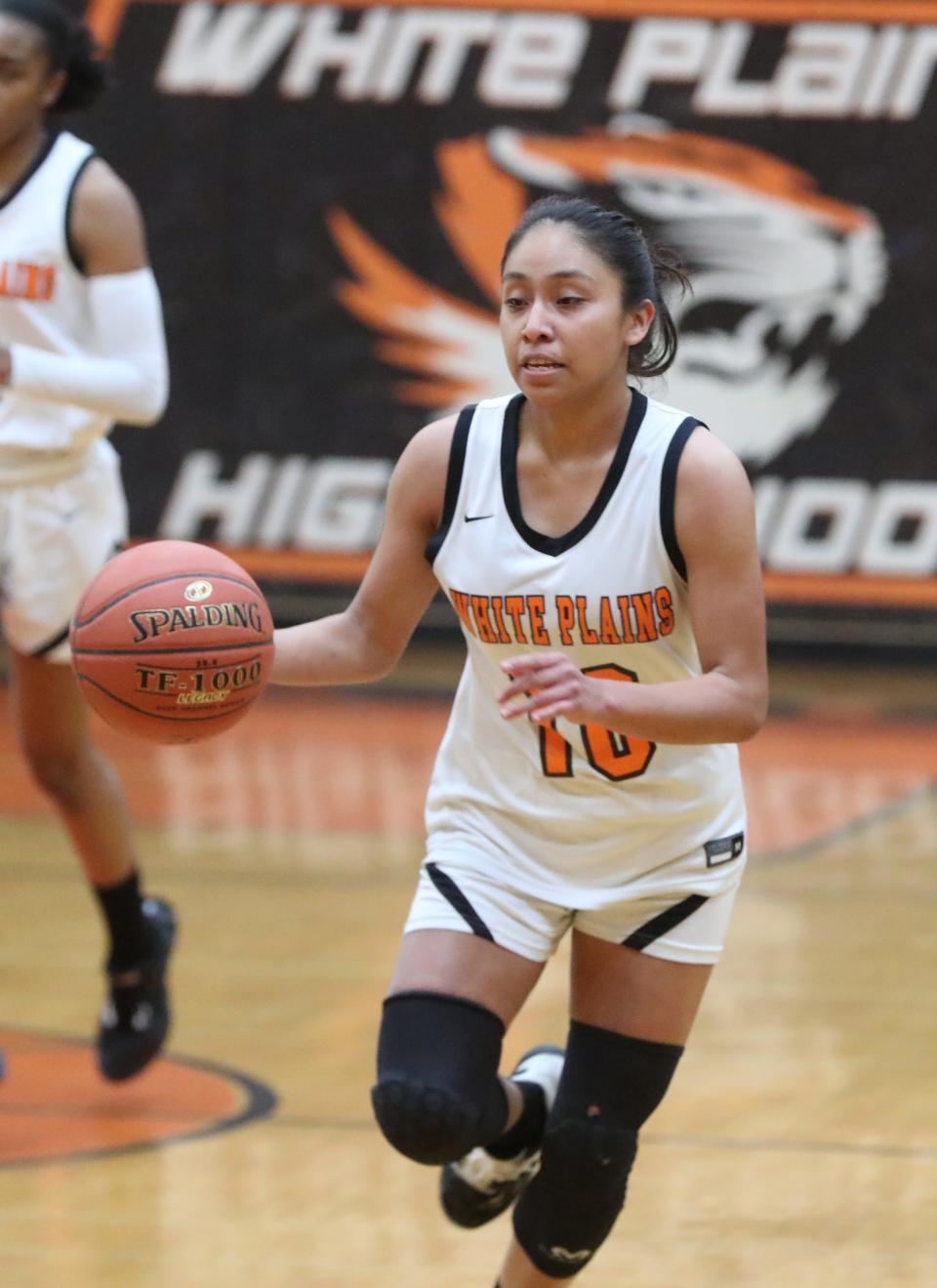 White Plains' Ineivi Plata brings the ball up-court during a Section 1 Class AA quarterfinal at Mamaroneck Feb. 24, 2023. White Plains beat New Rochelle 65-42.
