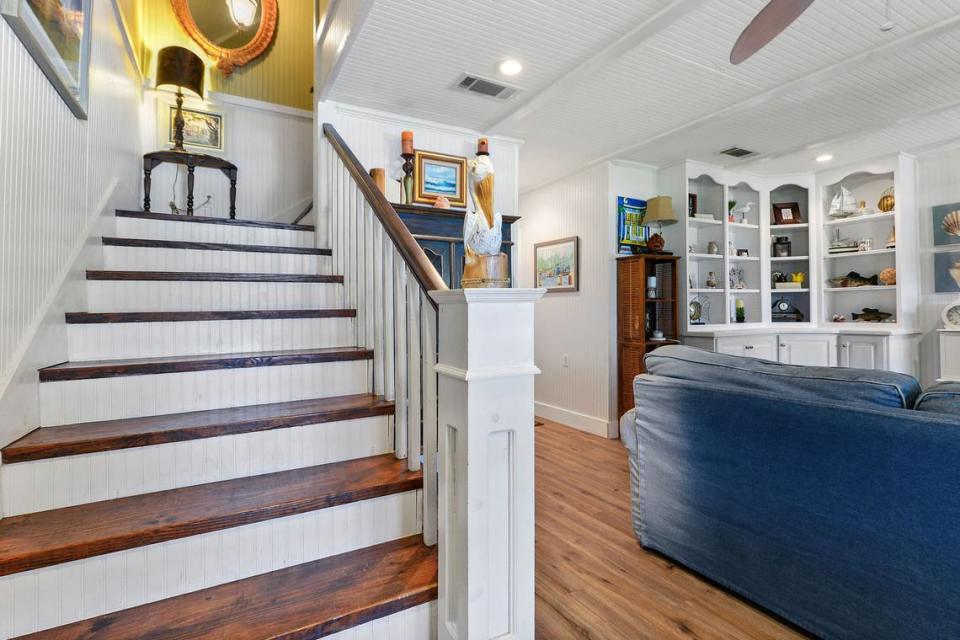 The stairs at Breezy Porches feature a pelican finial and wood-pegged steps. MS Real Estate Photography