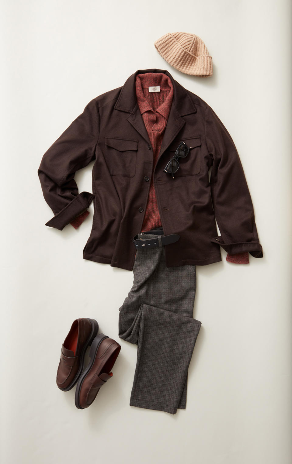 Fioroni cashmere unconstructed overshirt, $3,395; Altea long- sleeve yak-wool and cashmere knit polo, $975; De Bonne Facture Italian wool flannel one-pleat trousers, $520; Loro Piana Travis Walk loafers in calfskin, $1,150; Gucci knitted hat, $430; Akoni black Japanese acetate sunglasses with dark gray lenses, $690; Hermès leather belt, $750