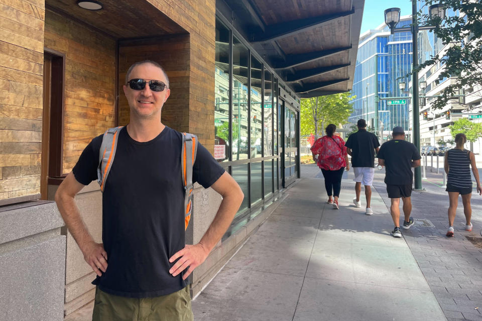 Democrat Matthew Toellner poses for a photo outside a grocery store in downtown Denver, Friday, June 28, 2024. After what he regards as President Joe Biden's subpar performance against Donald Trump, Toellner can't bring himself to fully commit to voting for the Democrat. For many voters not aligned with Trump, there's despair in the air. In dozens of interviews across the country, debate-watchers voiced dismay at the choices they have in November and some question whether both Biden and Trump are fit to serve. (AP Photo/Jesse Bedayn)