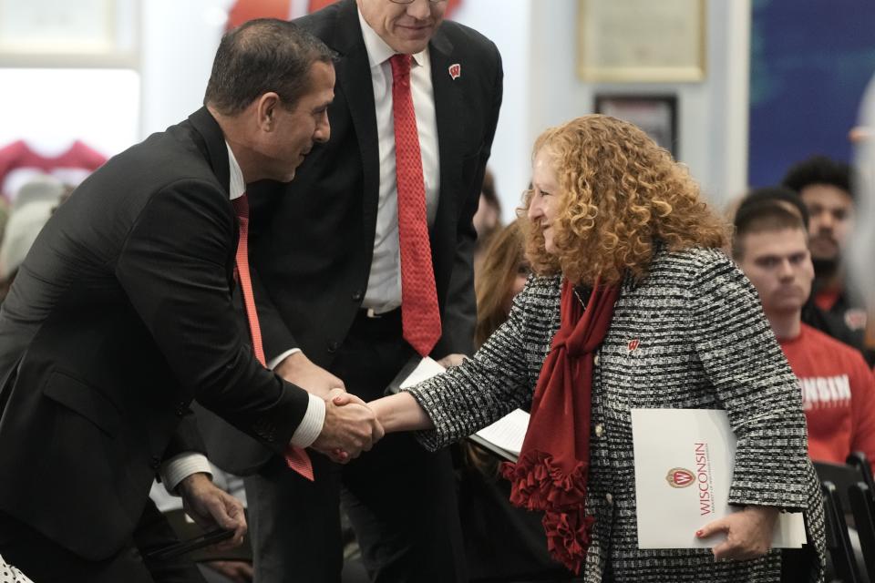 Wisconsin new head football coach Luke Fickell shakes hands with Wisconsin Chancellor Jennifer Mnookin after being introduced Monday, Nov. 28, 2022, in Madison, Wis. (AP Photo/Morry Gash)