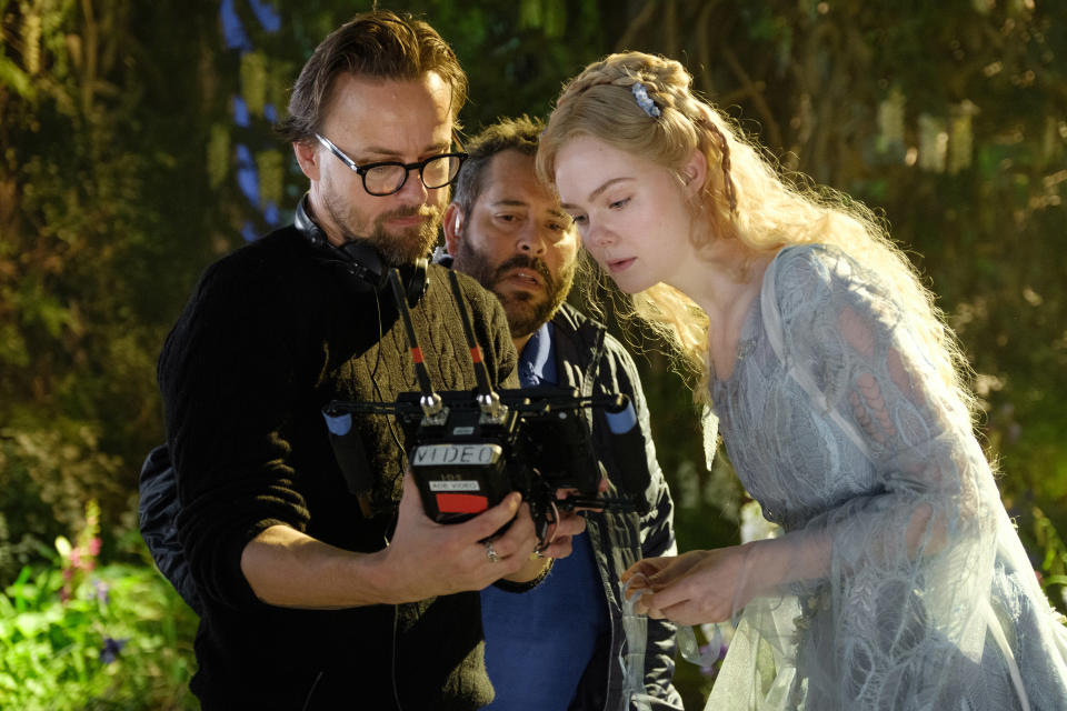 Joachim Rønning and Elle Fanning on the set of Disney's live-action Maleficent: Mistress of Evil. (Disney)