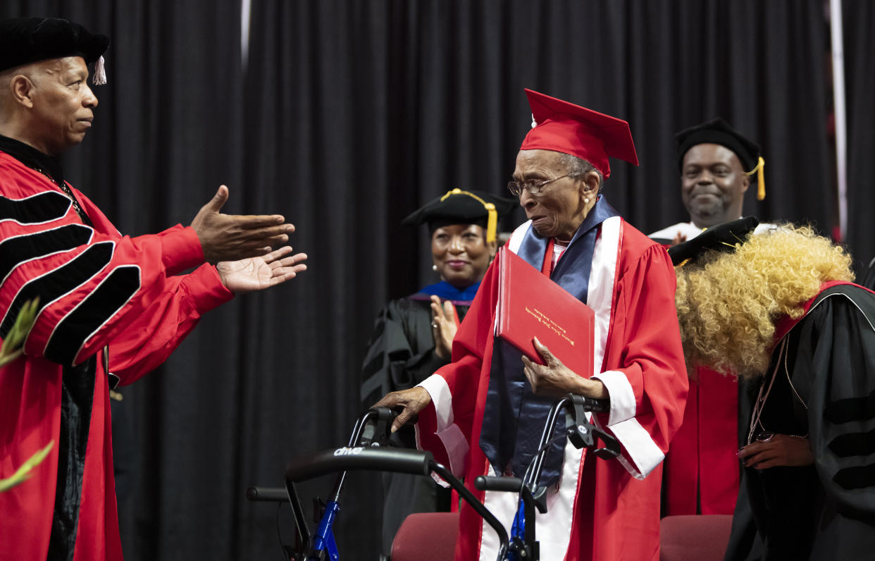 Elizabeth Barker Johnson walks across the graduation stage to receive her Winston-Salem State University diploma nearly 70 years after finishing her degree. (Credit: Winston Salem State University)