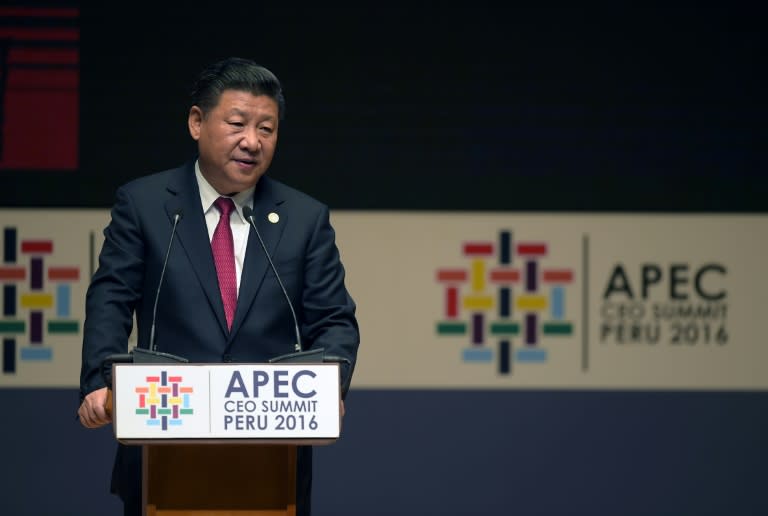 China's President Xi Jinping speaks during a session of the APEC CEO Summit, part of the broader Asia-Pacific Economic Cooperation Summit in Lima on November 19, 2016