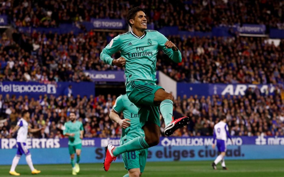 Soccer Football - Copa del Rey - Round of 16 - Real Zaragoza v Real Madrid - La Romareda, Zaragoza, Spain - January 29, 2020 Real Madrid's Raphael Varane celebrates scoring their first goal - REUTERS 