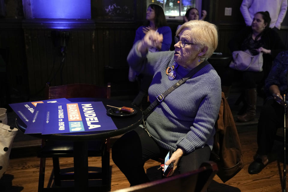 A supporter watches as results come in before Wisconsin Democratic U.S. Senate candidate Mandela Barnes speaks at his election night party Tuesday, Nov. 8, 2022, in Milwaukee. (AP Photo/Morry Gash)