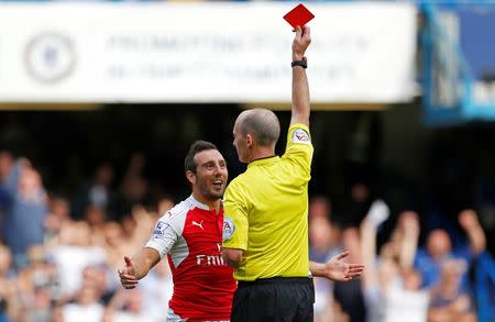 Football - Chelsea v Arsenal - Barclays Premier League - Stamford Bridge - 19/9/15 Arsenal's Santi Cazorla is shown a red card by referee Mike Dean Action Images via Reuters / John Sibley Livepic