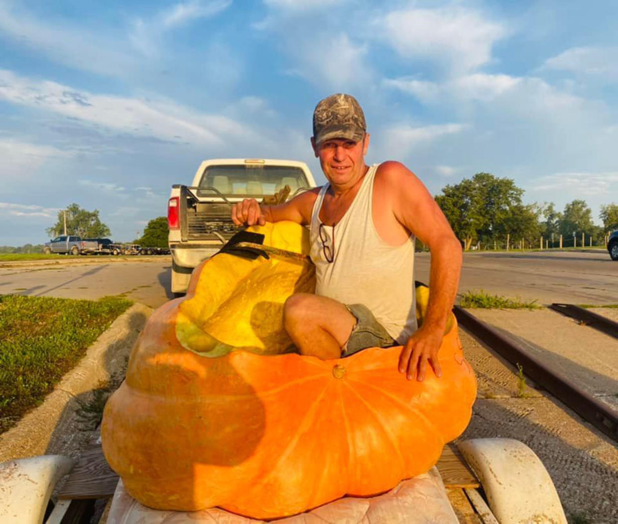 Duane Hansen in his giant pumpkin, SS Berta, complete with a beer cupholder. (Courtesy City of Bellevue, Nebraska via Facebook / Duane Hansen)