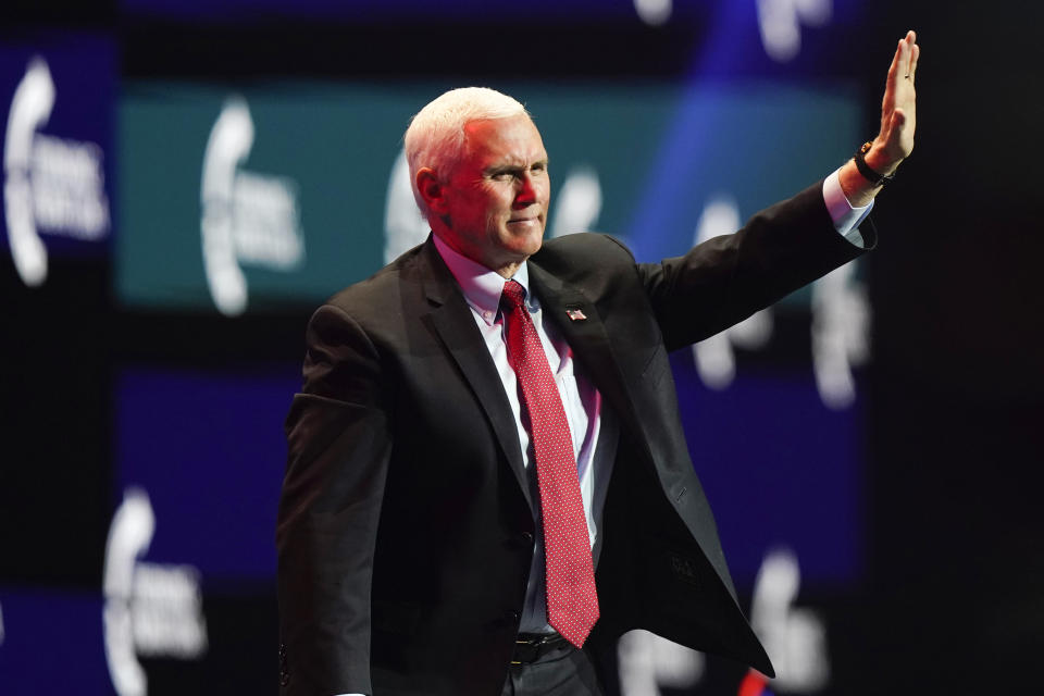 Vice President Mike Pence waves as he walks off the stage after speaking at the Turning Point USA Student Action Summit, Tuesday, Dec. 22, 2020, in West Palm Beach, Fla. (AP Photo/Lynne Sladky)