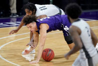 Northwestern guard Ty Berry (3) battles for a loose ball against Chicago State forward Kalil Whitehead during the second half of an NCAA college basketball game in Evanston, Ill., Saturday, Dec. 5, 2020. (AP Photo/Nam Y. Huh)