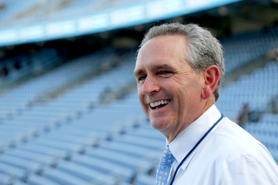 North Carolina athletics director Bubba Cunningham smiles as he talks with Kenan Stadium workers before a football game against Miami in September 2019. (AP Photo / Chris Seward)