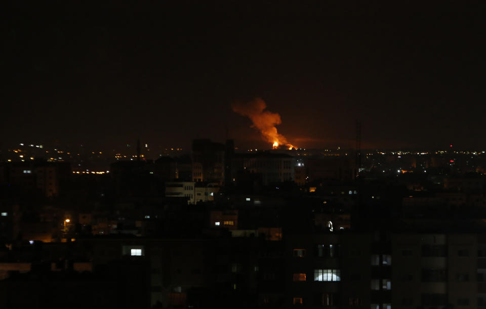 An explosion caused by Israeli airstrikes is seen on Gaza City, early Saturday, Oct. 27, 2018. Israeli aircraft struck several militant sites across the Gaza Strip early Saturday shortly after militants fired rockets into southern Israel, the Israeli military said. (AP Photo/Adel Hana)