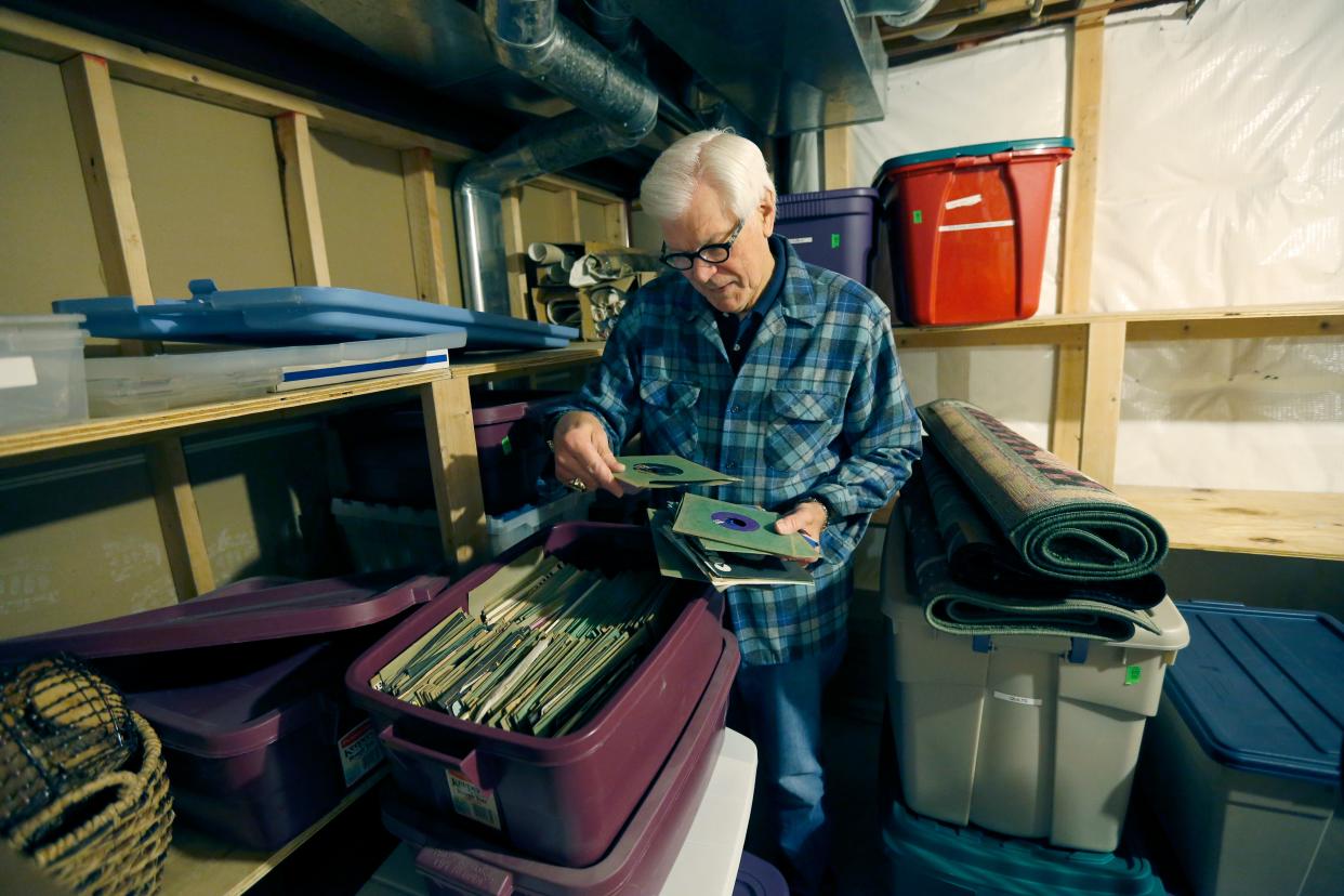 File Photo 2017: 2017: Reminiscing, Don Alhart looks through his record collection at his home of 24 years while movers put things in containers.