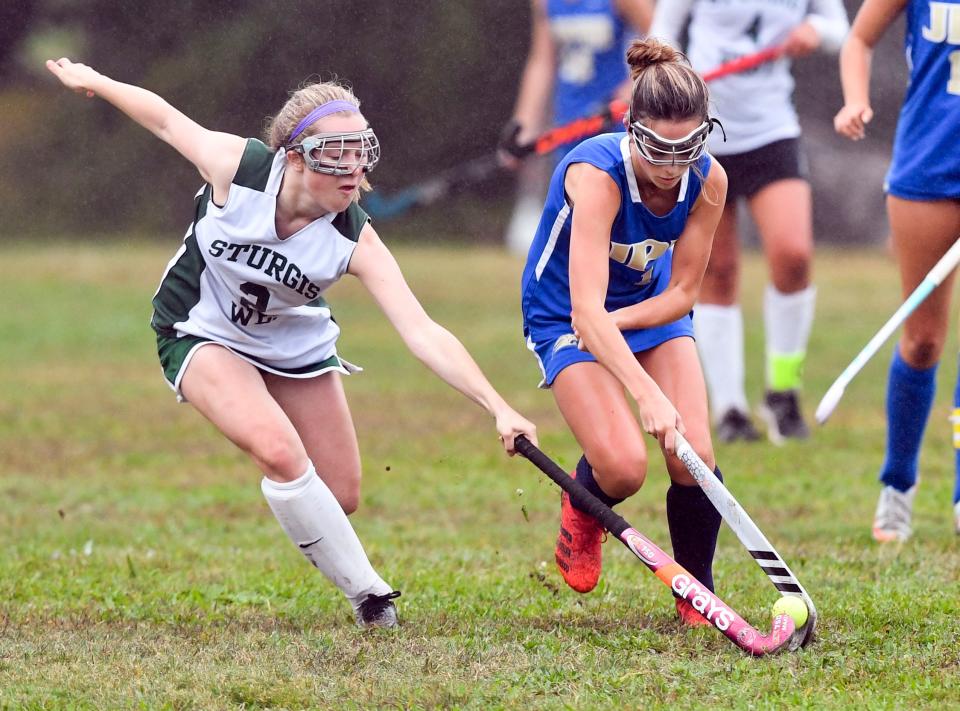 Hannah Macpherson of Sturgis West reaches in on Sophie Stanley of St. John Paul II during an Oct. 5, 2021 game in South Yarmouth.