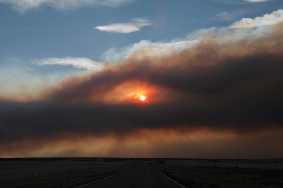 The sun burns through a smoky sky outside Ocate, NM as the Calf Canyon/Hermits Peak fire continues to spread (REUTERS)