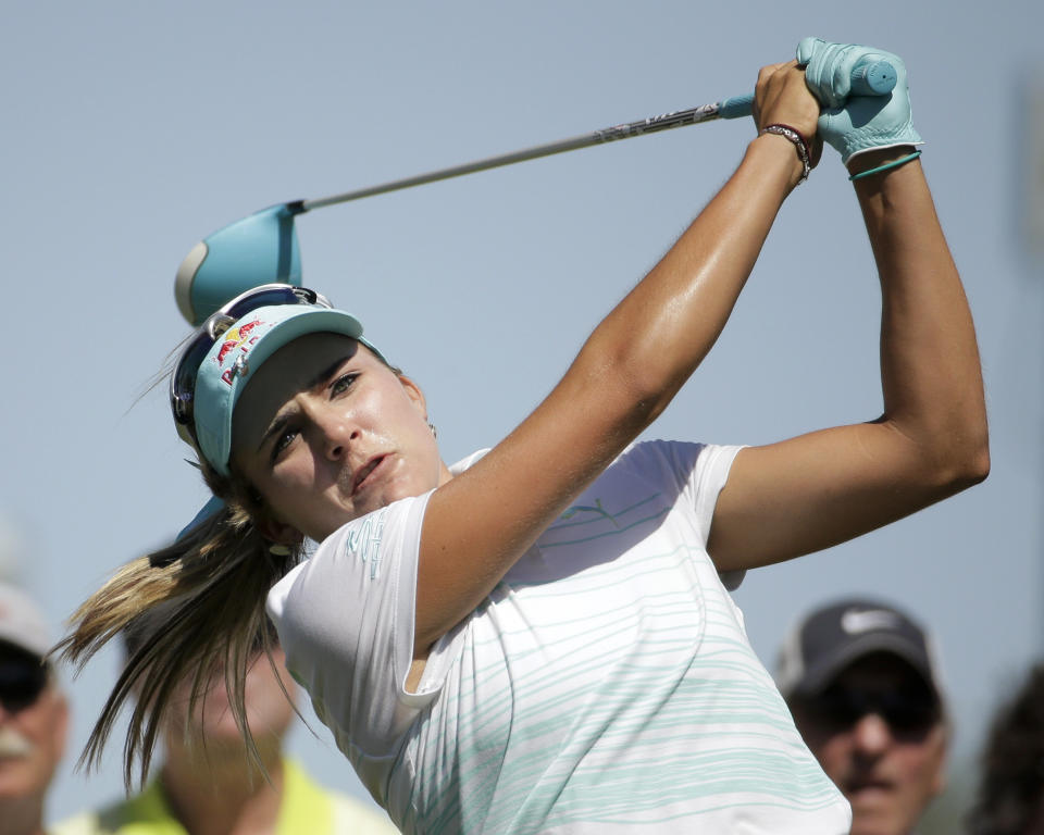 Lexi Thompson watches her tee shot on the third hole during the final round of the Kraft Nabisco Championship golf tournament Sunday, April 6, 2014, in Rancho Mirage, Calif. (AP Photo/Chris Carlson)