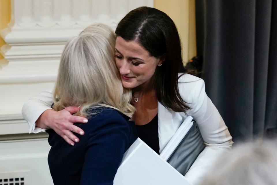 Cassidy Hutchinson, former aide to Trump White House chief of staff Mark Meadows, hugs vice chair Rep. Liz Cheney, R-Wyo., after testifying to the House select committee investigating the Jan. 6 attack on the U.S. Capitol.