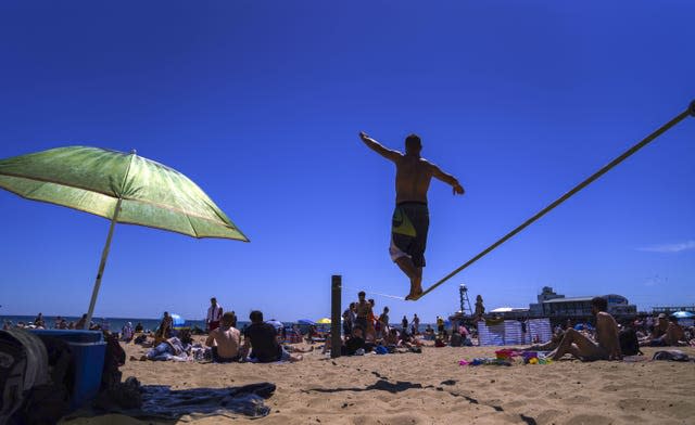 People enjoy the weather on Bournemouth beach in Dorset 