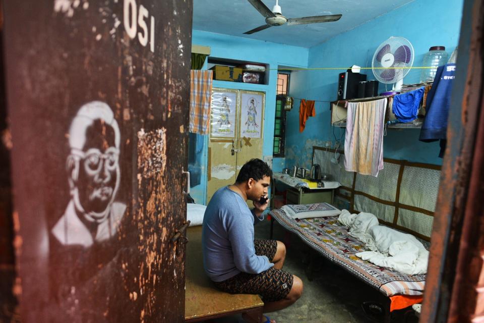 NEW DELHI, INDIA - JANUARY 6: Suryaprakash, a blind research scholar pursuing MPhil in Sanskrit, speaks on the phone while sitting in his room at Sabarmati Hostel, Jawaharlal Nehru University (JNU), on January 6, 2020 in New Delhi, India. He was also beaten up during yesterdays violence inside the campus. (Photo by Vipin Kumar/Hindustan Times via Getty Images)