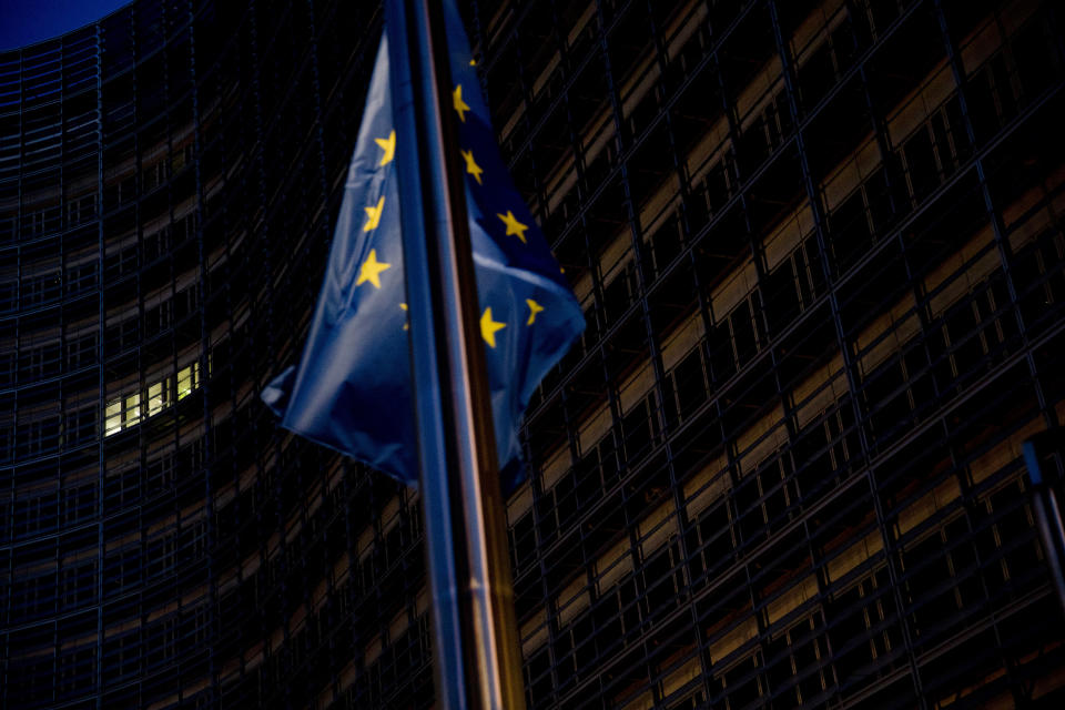 A European Union flag flies outside the European Commission headquarters in Brussels, Sunday, Oct. 14, 2018. Britain's Brexit secretary and the top European Union negotiator met for surprise talks Sunday and ambassadors from the 27 remaining EU countries gathered for a hastily scheduled discussion as the push for progress on a divorce deal quickened ahead of a vital summit. (AP Photo/Francisco Seco)