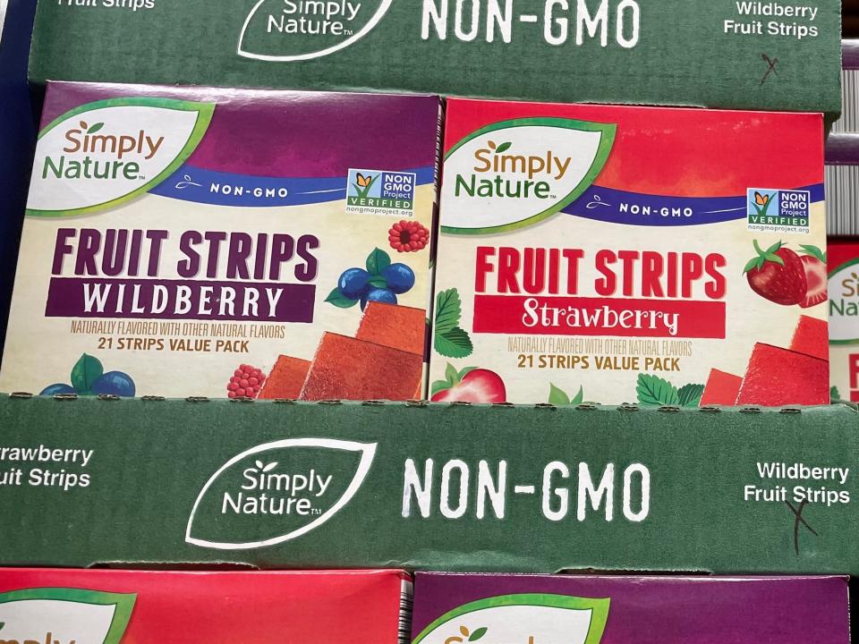 Boxes of fruit strips stacked on shelf at Aldi