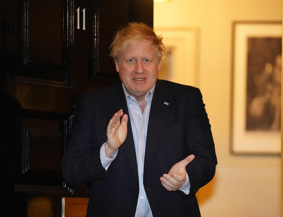 LONDON, April 2, 2020 .File photo taken on April 2, 2020 shows British Prime Minister Boris Johnson clapping for National Health Service staff outside 11 Downing Street in London, Britain. British Prime Minister Boris Johnson was taken to intensive care on Monday night after his coronavirus symptoms worsened, Downing Street said. Johnson has asked Foreign Secretary Dominic Raab to deputize for him, a Downing Street spokesman said. (Pippa Fowles/No 10 Downing Street/Handout to Xinhua via Getty) (EDITORIAL USE ONLY) (Xinhua/Han Yan via Getty Images)