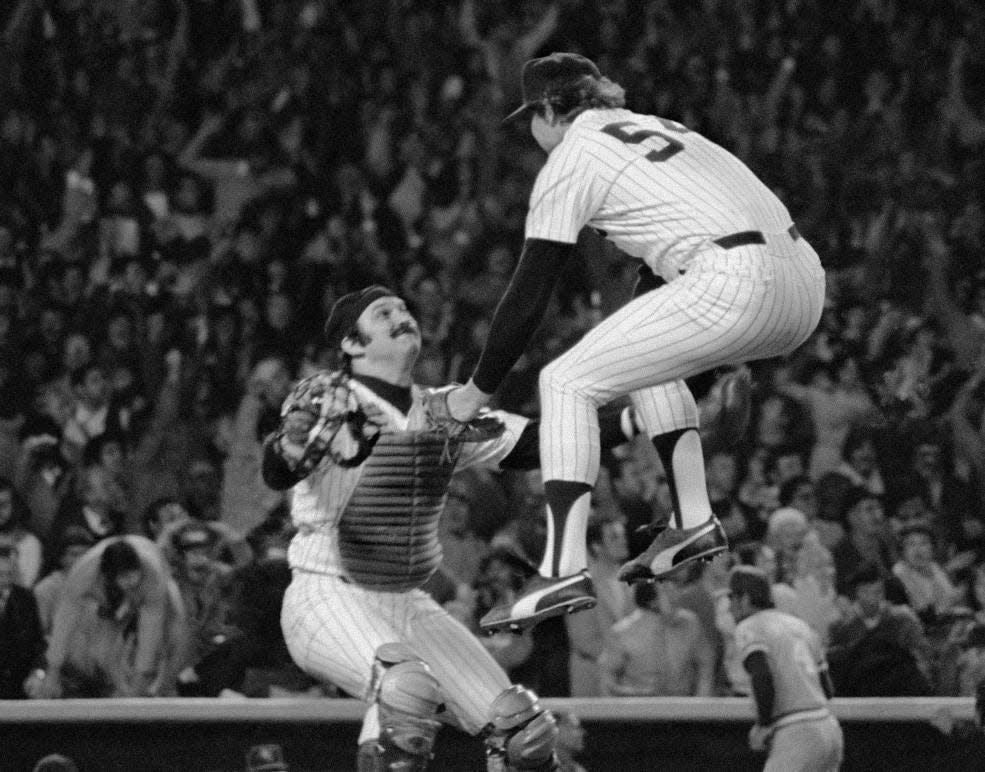 Thurman Munson waits for teammate "Goose" Gossage to leap into his arms after the New York Yankees beat the Kansas City Royals in the 1978 American League Championship Series.